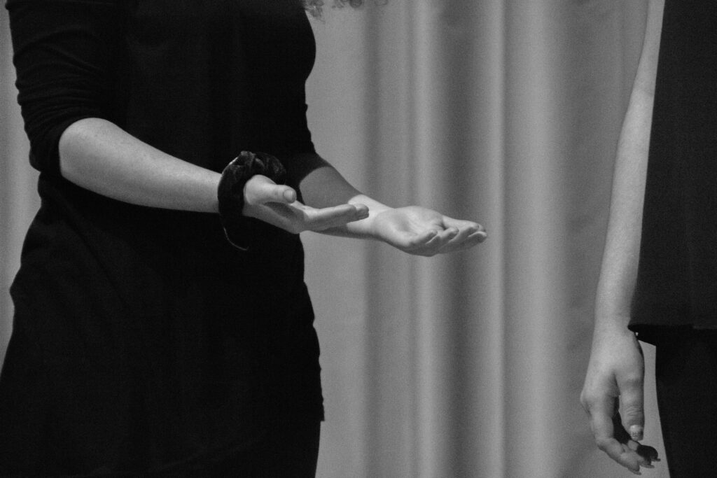 Hands hovering above glowing energy symbols, representing intuitive mentorship