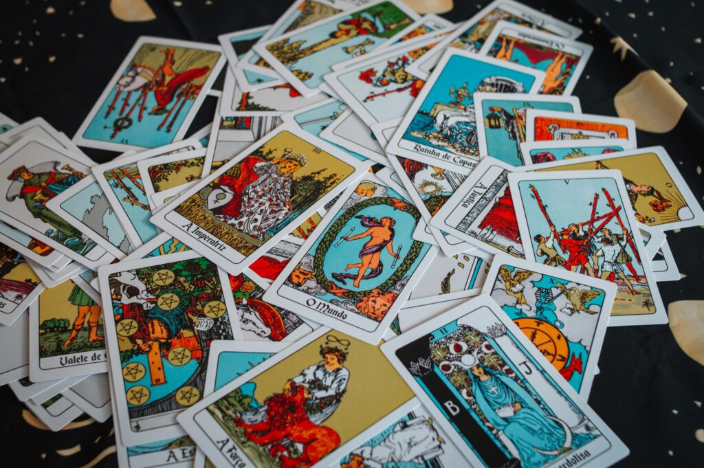 all the tarot cards messed up in a pile on the floor
