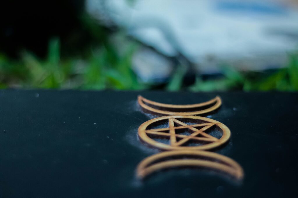 Dark Grimoire Tarot Book cover displaying intricate symbolic artwork for shadow tarot and shadow work.